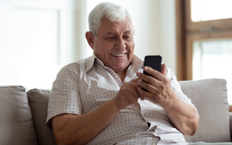 An illustrative image of a man talking on a smartphone (fizkes, iStock by Getty Images)