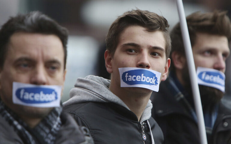 Illustrative: People protest in front of the Facebook office in Warsaw, Poland, Saturday, Nov. 5, 2016. (AP/Czarek Sokolowski)