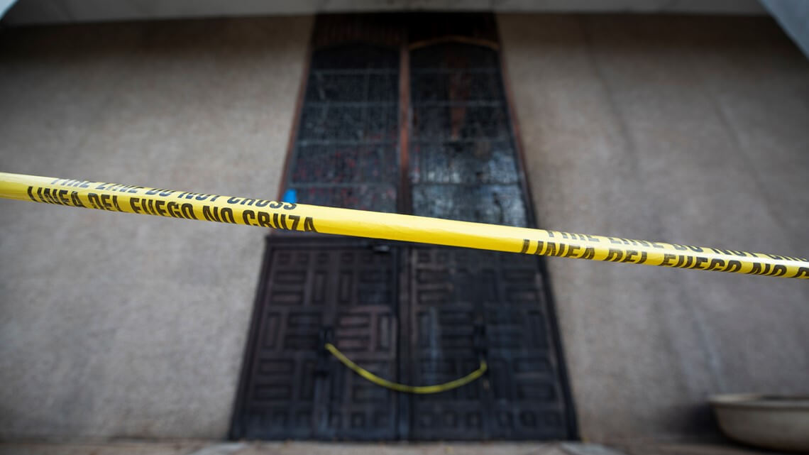 The soot-blackened front doors of Congregation Beth Israel in Austin, Texas. An 18-year-old arsonist attempted to burn down the synagogue on Oct. 31, 2021.
