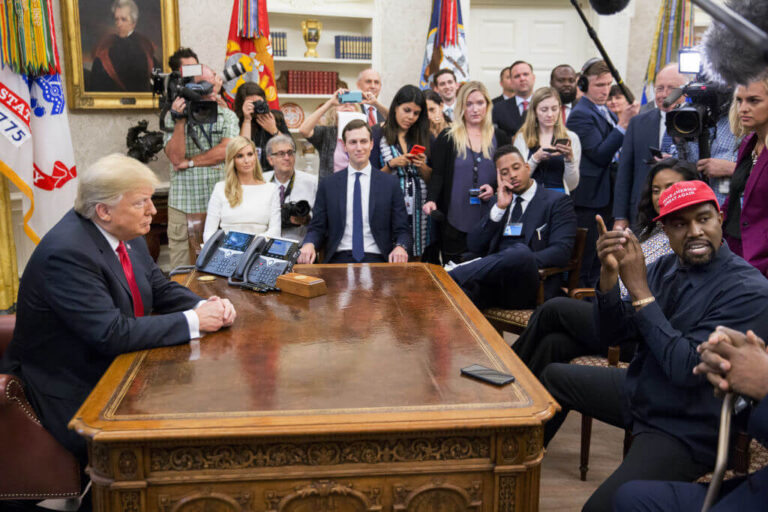 Rapper Kanye West, right, speaks as U.S. President Donald Trump, left, listens on Oct. 11, 2018.