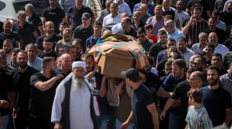 Mourners attend the funeral on October 14, 2023 of an Arab Israeli who was killed when a rocket fired by Hamas hit his house in Abu Gosh, outside of Jerusalem. (Jamal Awad/Flash90)