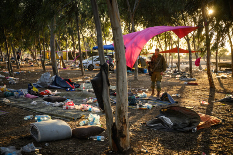 Members of the security forces continue to search for identification and personal effects at the Supernova Music Festival site, where hundreds were killed and dozens taken by Hamas militants near the border with Gaza. Oct. 12, 2023 in Kibbutz Re