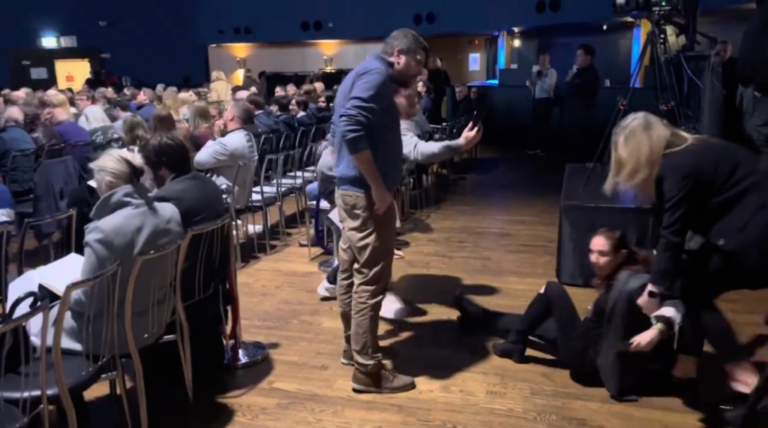 Lior Tibet, an Israel-Irish researcher, is dragged out of a Holocaust memorial ceremony after protesting comments by Irish President Michael Higgins in Dublin, Jan. 26, 2025. (Screenshot)