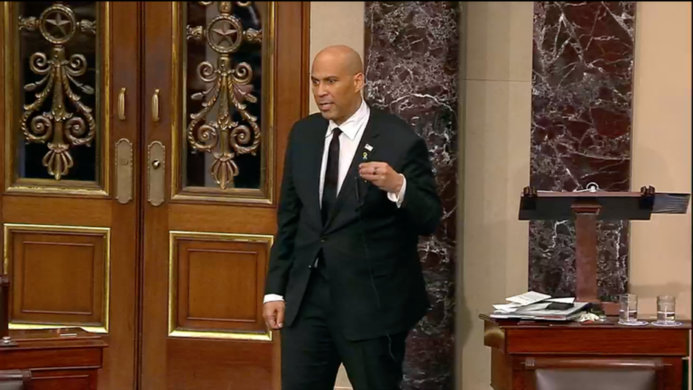 Sen. Cory Booker wears a hostage pin during a marathon speech on the Senate floor, April 1, 2025. (Screenshot)